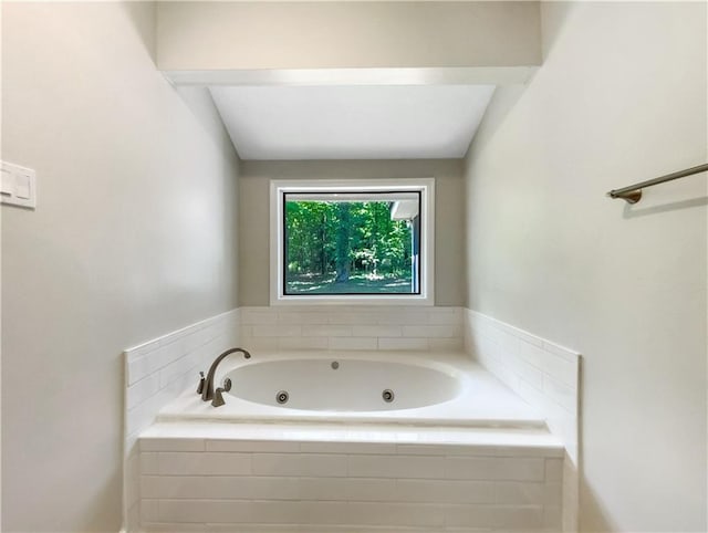 bathroom with tiled bath