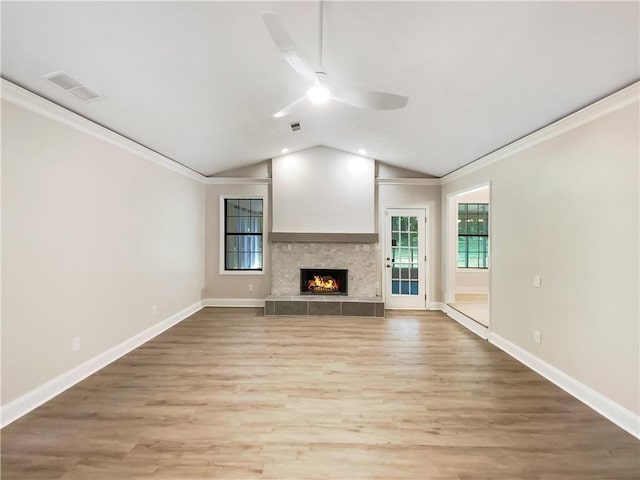 unfurnished living room featuring ceiling fan, vaulted ceiling, and light hardwood / wood-style flooring