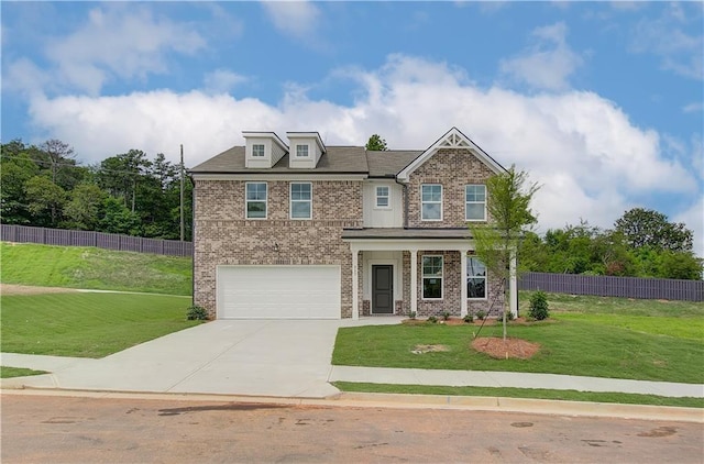 craftsman house with fence, brick siding, a garage, a front yard, and driveway