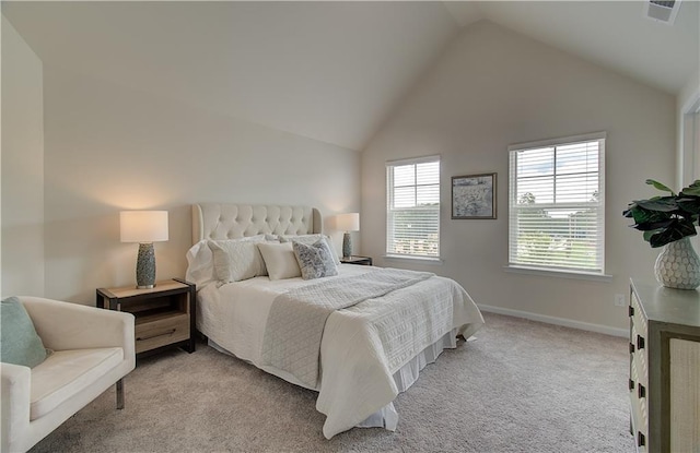 bedroom with baseboards, vaulted ceiling, light carpet, and visible vents
