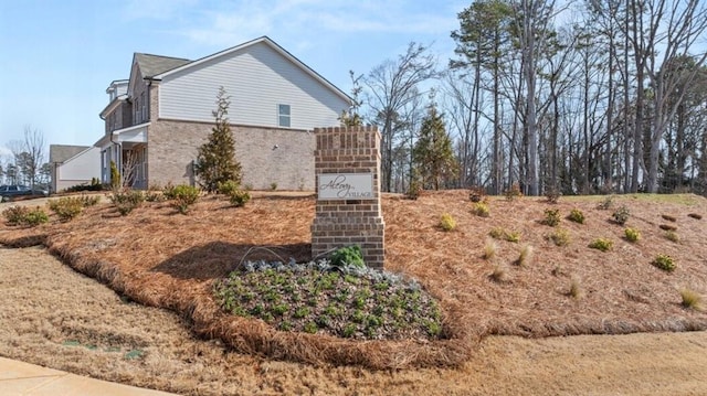 view of home's exterior with brick siding