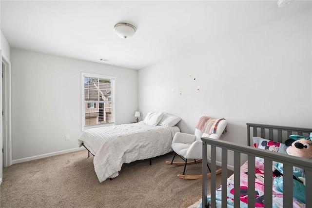 bedroom with carpet flooring, baseboards, and visible vents
