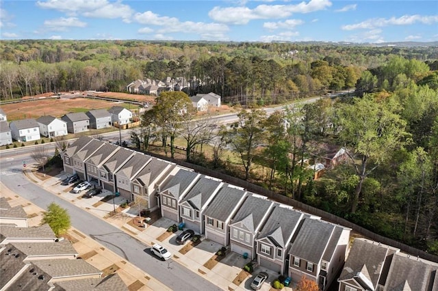 birds eye view of property with a residential view and a forest view