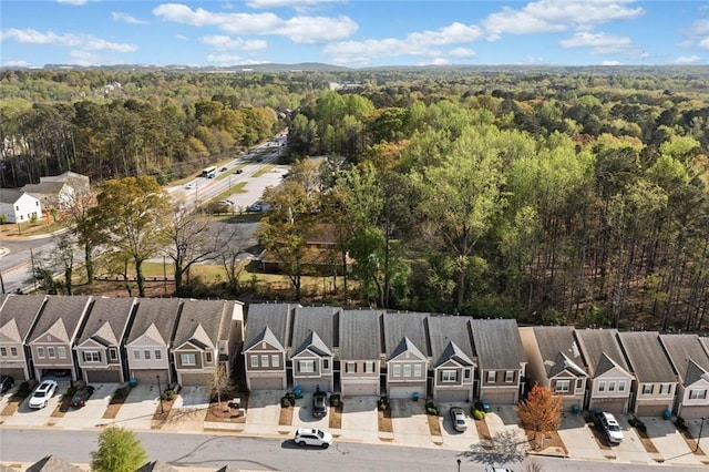birds eye view of property with a residential view and a forest view