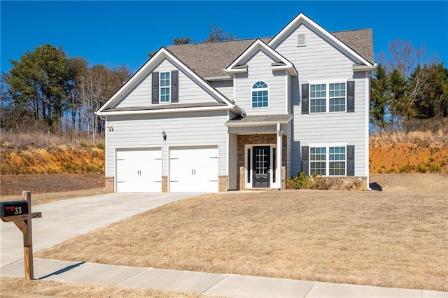 view of front of property with a garage