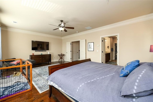 bedroom featuring dark wood-style floors, visible vents, ornamental molding, and a ceiling fan