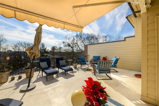 view of patio with a fire pit