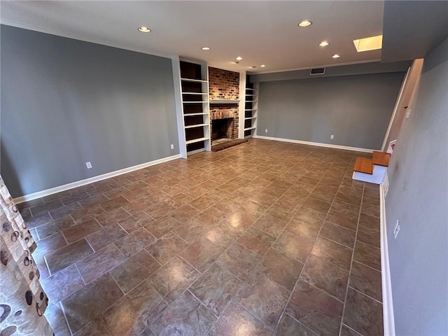 basement with baseboards, a brick fireplace, recessed lighting, and built in shelves