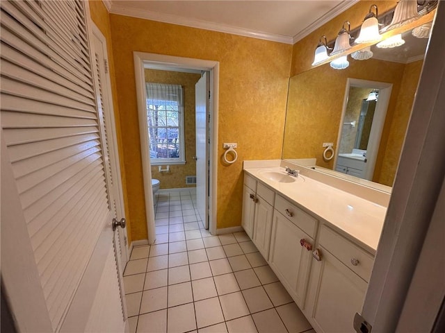 bathroom featuring tile patterned flooring, vanity, toilet, visible vents, and ornamental molding