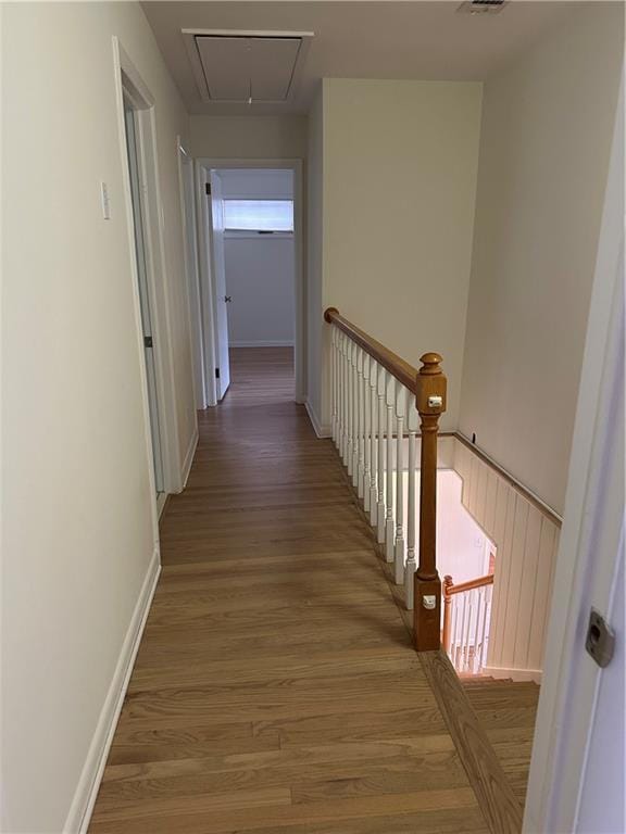 6542 Cherry Tree Ln, Atlanta, GA 30328 - corridor with attic access, an upstairs landing, and wood finished floors