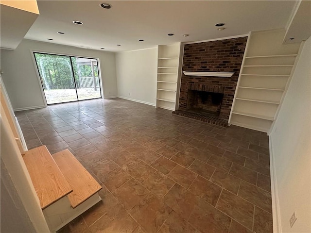 6542 Cherry Tree Ln, Atlanta, GA 30328 - unfurnished living room with built in shelves, a fireplace, and recessed lighting