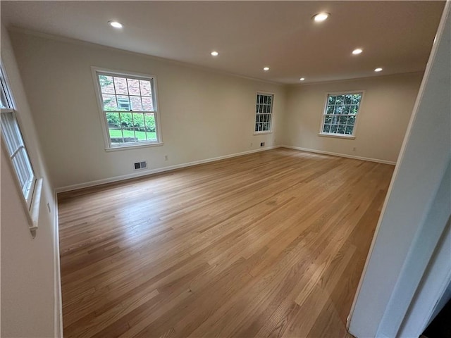 6542 Cherry Tree Ln, Atlanta, GA 30328 - unfurnished room with crown molding, recessed lighting, plenty of natural light, and light wood finished floors