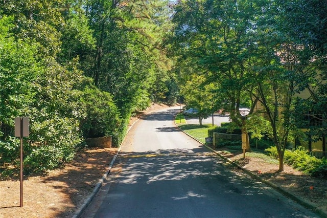 3721 Stonewall Cir SE, Atlanta, GA 30339 - view of asphalt street with curbs and a view of trees