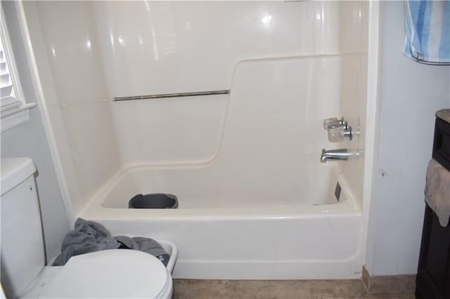 bathroom with shower / bath combination and toilet