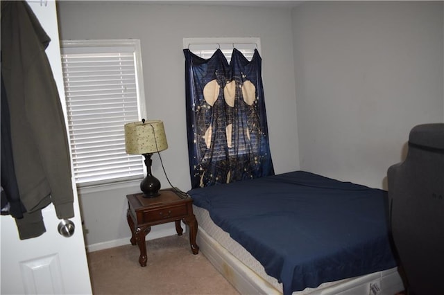 bedroom with light colored carpet