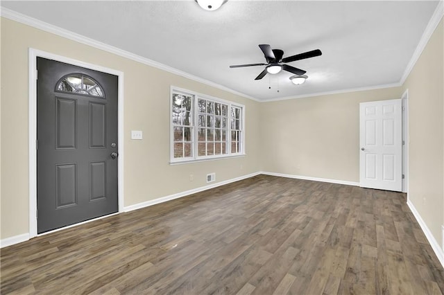 entrance foyer featuring crown molding, ceiling fan, and dark hardwood / wood-style flooring