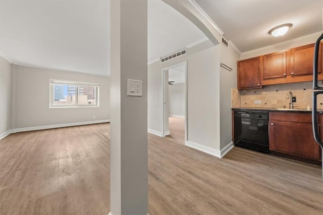 kitchen featuring black dishwasher, light wood-style flooring, visible vents, and decorative backsplash