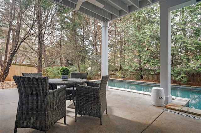 view of patio with a fenced in pool