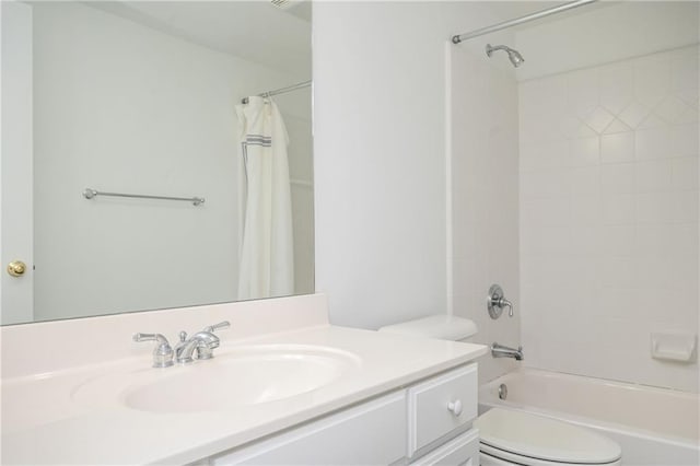 full bathroom featuring shower / bathtub combination with curtain, vanity, and toilet