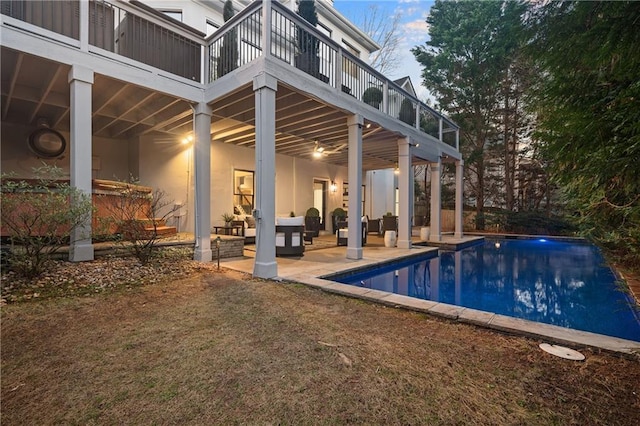 view of swimming pool with a yard and a patio area