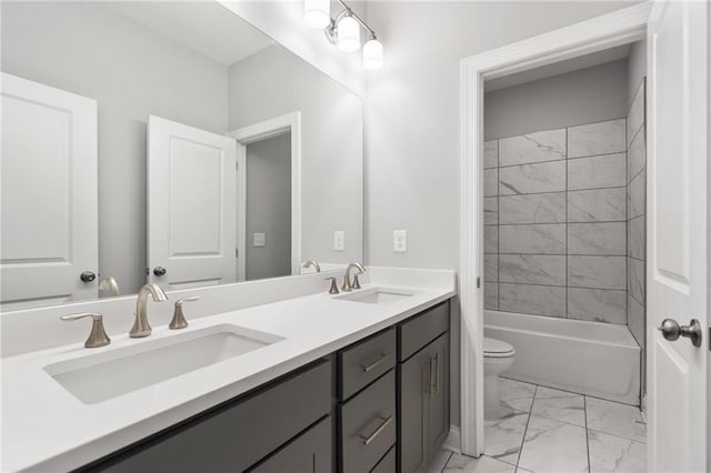 full bathroom with toilet, tiled shower / bath combo, and vanity