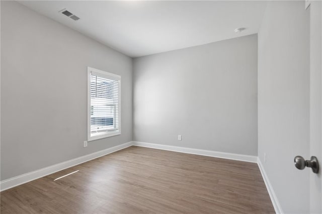 empty room featuring hardwood / wood-style flooring