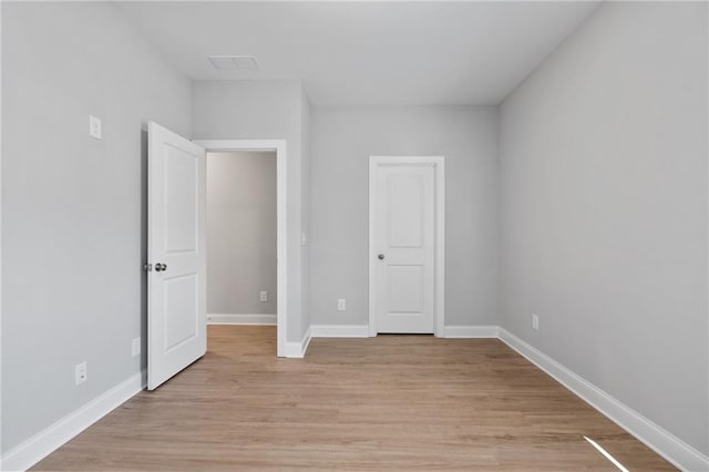 unfurnished bedroom with light hardwood / wood-style floors