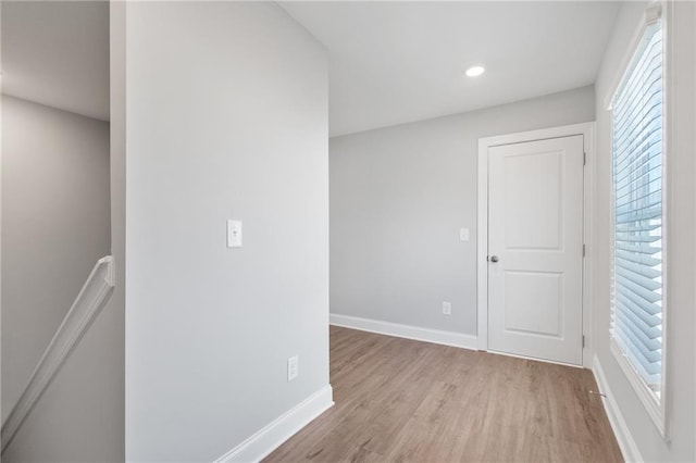 unfurnished room featuring light hardwood / wood-style floors and a wealth of natural light