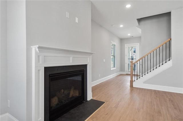 living room with light hardwood / wood-style floors