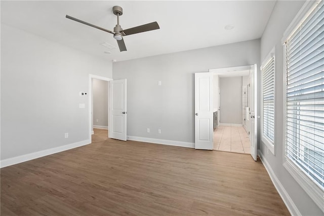 unfurnished bedroom featuring hardwood / wood-style flooring and ceiling fan