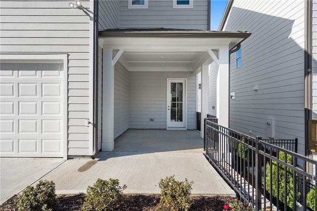 entrance to property featuring a garage