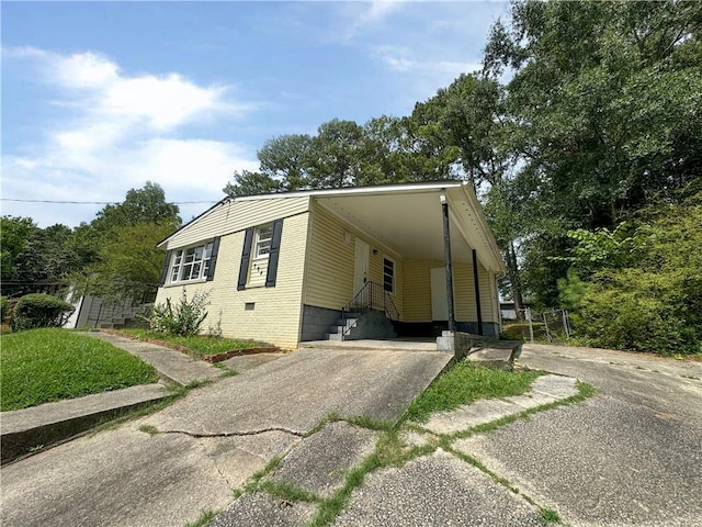 view of property exterior with a carport