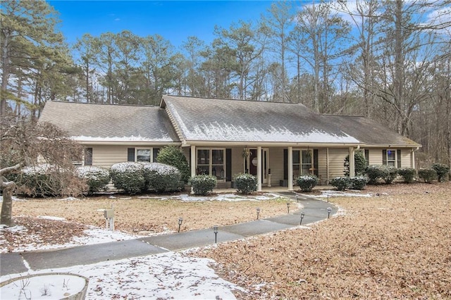 single story home featuring covered porch