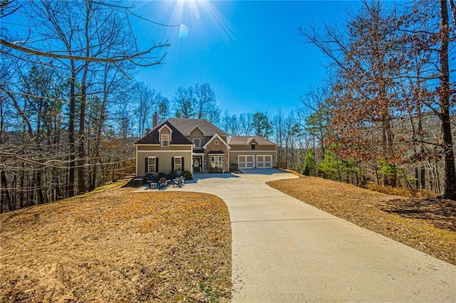 view of front of property featuring a garage and a porch