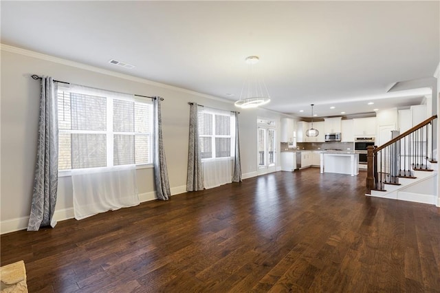 unfurnished living room with dark wood-style flooring, visible vents, baseboards, and stairs