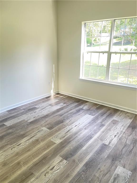 203 Sea Marsh Ct, Fayetteville, GA 30215 - empty room with baseboards and wood finished floors