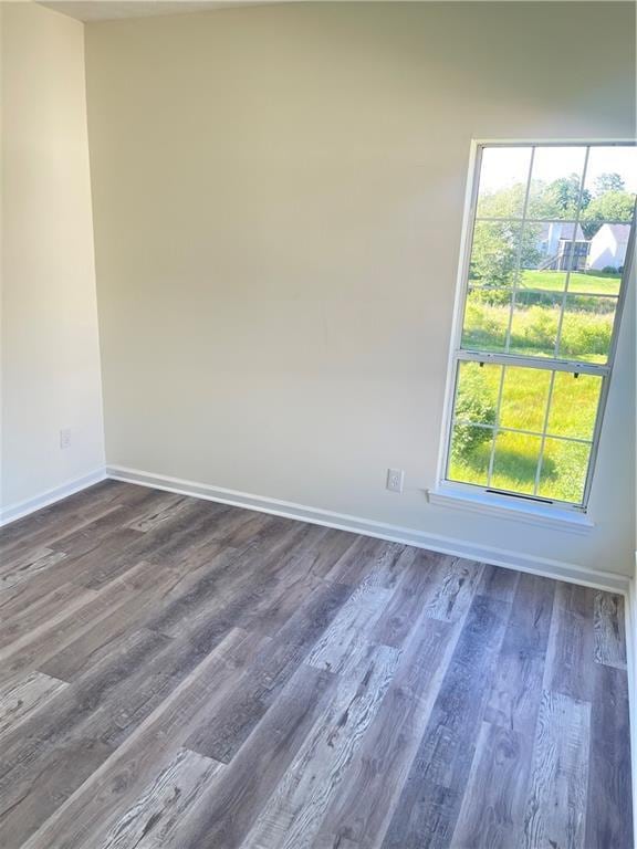 203 Sea Marsh Ct, Fayetteville, GA 30215 - spare room with baseboards and dark wood-style floors