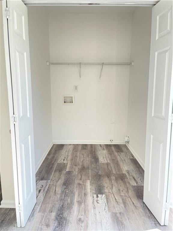 203 Sea Marsh Ct, Fayetteville, GA 30215 - laundry room featuring washer hookup, wood finished floors, and baseboards
