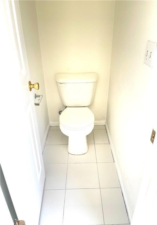 203 Sea Marsh Ct, Fayetteville, GA 30215 - bathroom with toilet, tile patterned floors, and baseboards