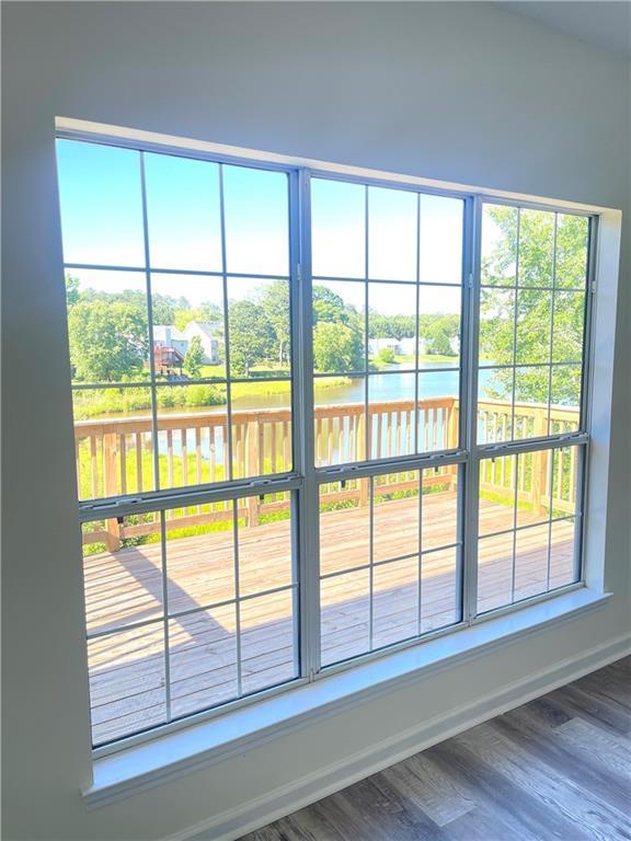 203 Sea Marsh Ct, Fayetteville, GA 30215 - detailed view of a nearby body of water, wood finished floors, and baseboards