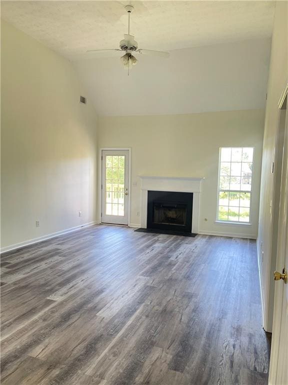 203 Sea Marsh Ct, Fayetteville, GA 30215 - unfurnished living room featuring high vaulted ceiling, dark wood-style floors, ceiling fan, a fireplace with flush hearth, and baseboards