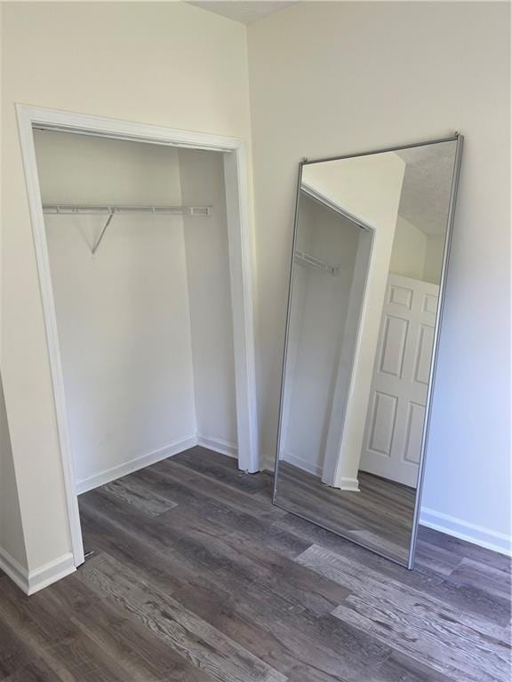 203 Sea Marsh Ct, Fayetteville, GA 30215 - unfurnished bedroom featuring dark wood-type flooring and baseboards