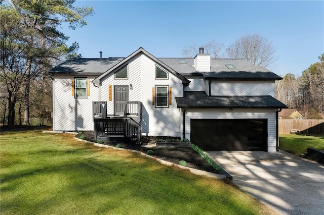 view of front of house featuring a front yard and a garage