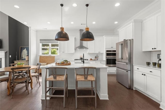 635 Opera Ln, Alpharetta, GA 30009 - kitchen with wall chimney exhaust hood, stainless steel appliances, light countertops, dark wood-type flooring, and recessed lighting