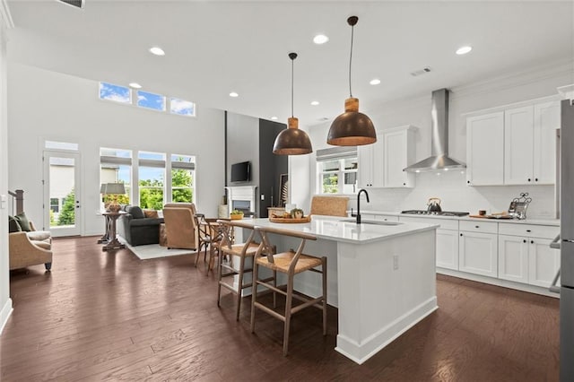 635 Opera Ln, Alpharetta, GA 30009 - kitchen featuring wall chimney exhaust hood, open floor plan, plenty of natural light, and recessed lighting