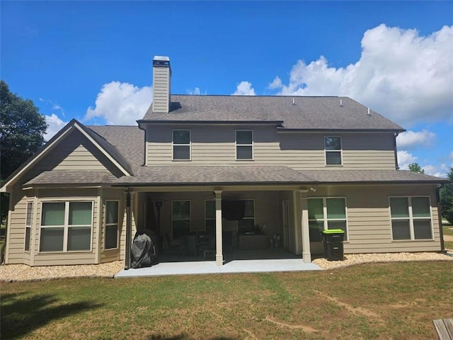 124 Archstone Sq, Mcdonough, GA 30253 - back of property featuring a patio, a yard, and a chimney