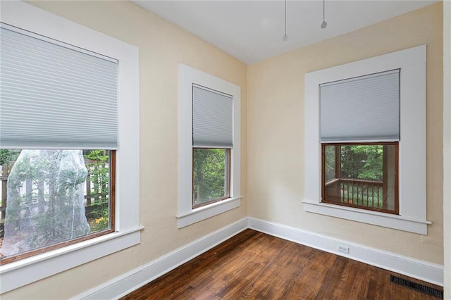 628 Home Ave SE, Atlanta, GA 30312 - unfurnished room with baseboards, healthy amount of natural light, and dark wood finished floors