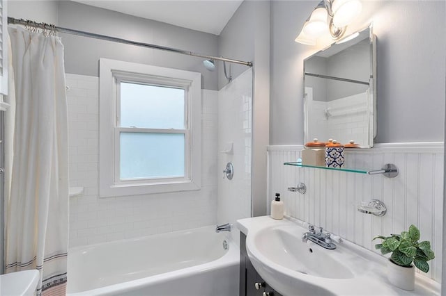 628 Home Ave SE, Atlanta, GA 30312 - full bathroom with shower / bath combo with shower curtain, wainscoting, and a sink
