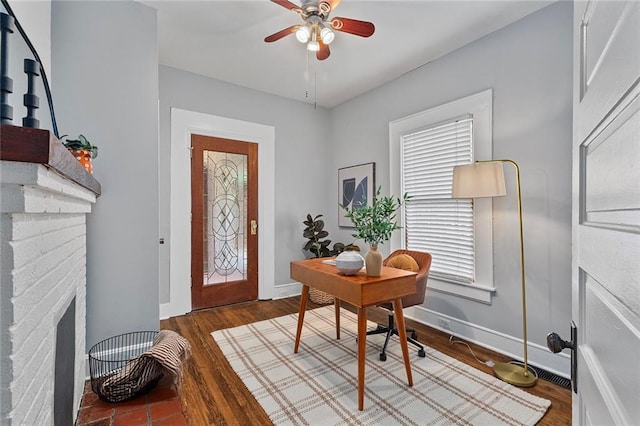 628 Home Ave SE, Atlanta, GA 30312 - office featuring ceiling fan, healthy amount of natural light, wood finished floors, and a brick fireplace