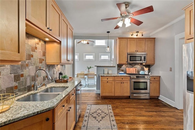628 Home Ave SE, Atlanta, GA 30312 - kitchen featuring stainless steel appliances, a sink, ceiling fan, decorative backsplash, and ornamental molding